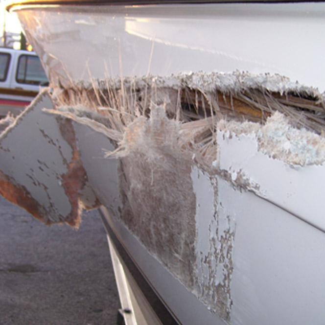 The fiberglass delamination extended close to the waterline. - Century Boat Fiberglass Repair 02
